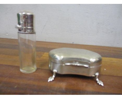 An early 20th century silver ring box on splayed feet and a silver and glass scent bottle 