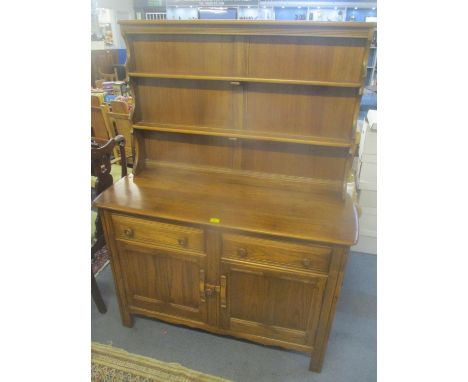 An Ercol Golden Dawn elm dresser having a plate rack above two drawers and cupboards 160 1/2cm h  x 122 1/2cm wLOCATION: BR 
