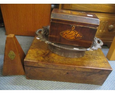 Treen to include a George III mahogany tea caddy, a metronome, a walnut box and a Black Forest style carved musical dish 