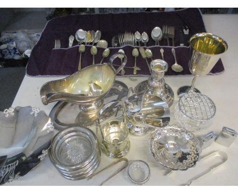 A quantity of silver plate, white metal and silver items to include cutlery and flatware, all housed in a basket, together wi