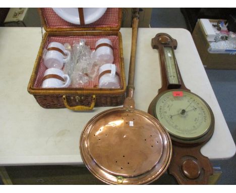 An early 20th century mahogany cased aneroid barometer together with a Victorian copper warming pan and a modern picnic set 