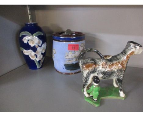 A Lambeth Doulton tobacco jar, a Royal Copenhagen vase, a creamer in the form of a cow and other ceramics to include 19th Cen