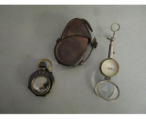A First World War military issue marching compass in leather case, stamped 1918 E. Koehn, Genève Suisse, No154463 to back, ha