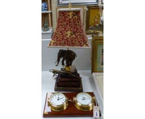   A Wempe wall-mounted ship's style clock/barometer and an 'elephant on books' table lamp