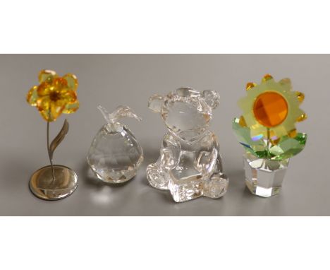   A Swarovski 'Sunflower', with topaz centre and yellow petals in clear glass pot (boxed), a smaller yellow flower and a Wate