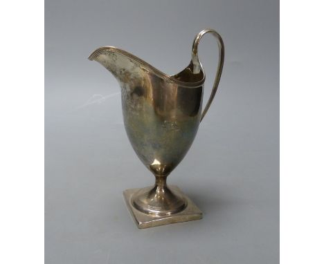   A George III silver helmet shaped cream jug, I.B, London, 1800, 14.9cm,114 grams.