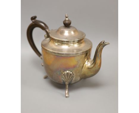   A circular silver teapot on three feet, Sheffield 1900,gross 16.5oz 