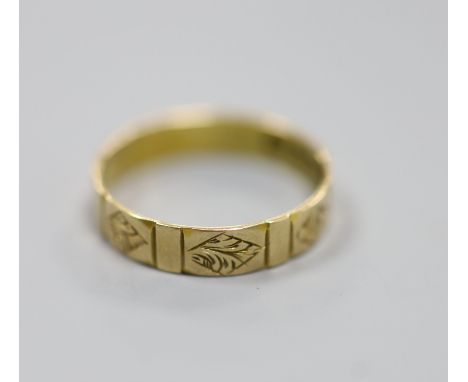   A Victorian engraved 15ct gold wedding band, size R,2.4 grams.