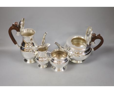   A four-piece silver 'Regent' tea service,of circular bulbous form, comprising teapot, hot water jug, cream jug and sucrier,