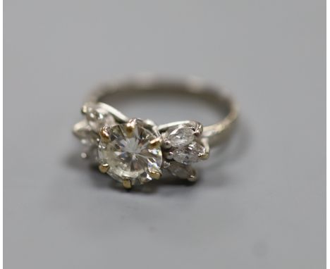   A white metal (stamped 18ct Plat) and single stone diamond ring, with six stone marquise cut diamond set shoulders, size K,