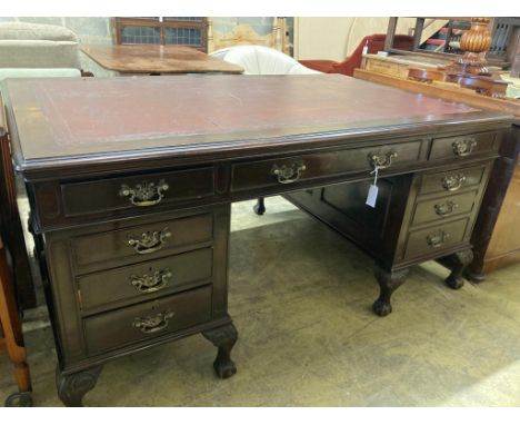   A 1920's Chippendale revival mahogany pedestal desk, length 166cm, depth 106cm, height 80cm