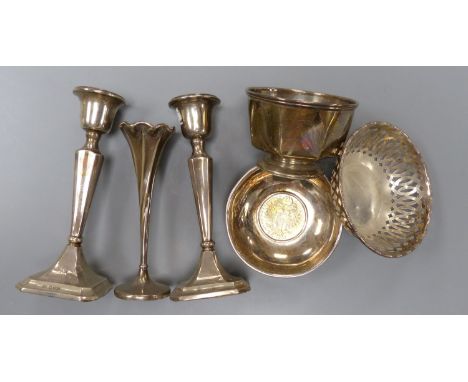   A pair of George V silver mounted candlesticks, 15.2cm, a silver posy vase, silver bowl, silver pierced dish and a 925 inse