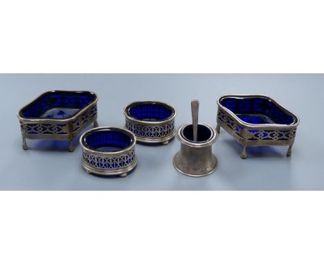   A pair of Edwardian pierced silver quatrefoil shaped salts with blue glass liners, London, 190987mm and three other smaller