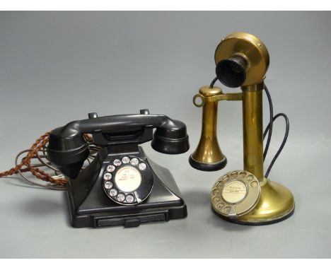   A vintage stick telephone and a black Bakelite telephone
