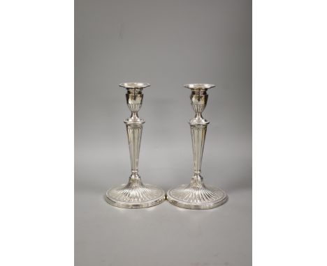   A pair of late Victorian silver oval candlesticks, with engraved inscription, Charles Stuart Harris Junior, London, 1891, h