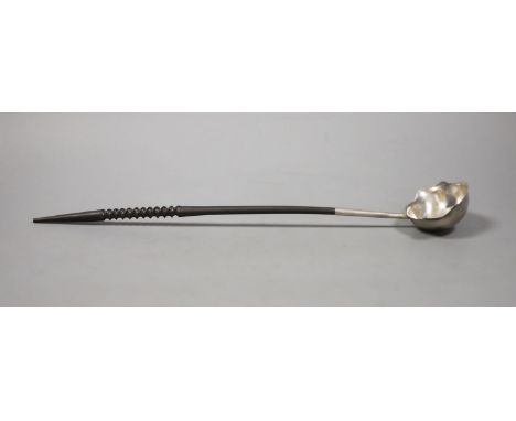   A George II silver toddy ladle with later? turned handle, maker, I.W, London, 1752, 39.4cm.