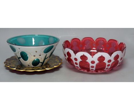   A Bohemian cranberry and white overlay glass circular bowl, a similar conical turquoise bowl and a gilded ruby glass dish40