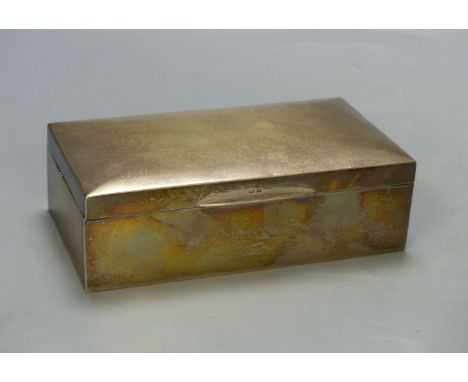   A George V silver mounted rectangular cigarette box, Birmingham, 1925, 16.6cm.