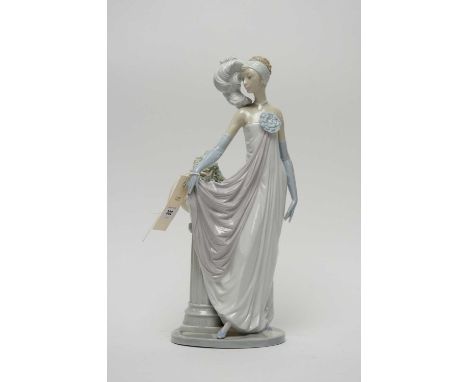 A Lladro ‘Socialite of the 20s’ ceramic figure of a lady, modelled in traditional roaring 1920s dress with feather headdress,