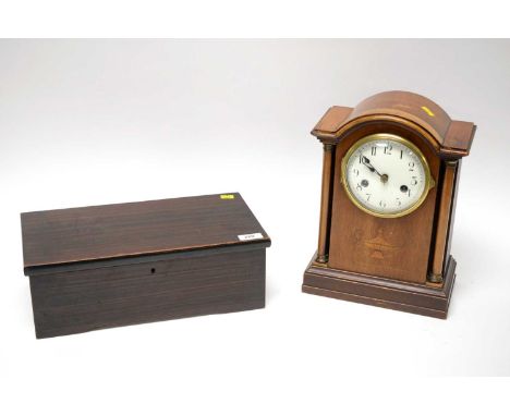 An antique music box, with paper ‘National Music Box’ slip, listing six airs, 35cms wide; together with an Edwardian inlaid w