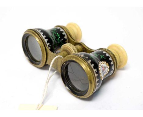 A pair of early 20th Century opera glasses, decorated with floral decorated enamel body and plastic lenses.