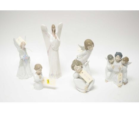 A collection of Lladro figures of cherubs, each with box; together with two Nao figures of angels, each with box. (6)