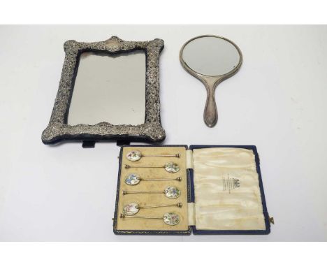 A silver mounted table mirror, by Henry Matthews, Birmingham 1902; a set of size silver and enamel coffee spoons, by William 