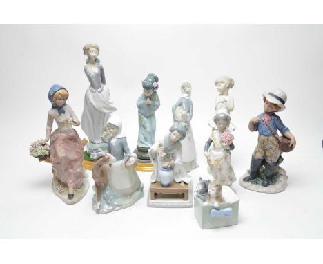 A collection of Lladro ceramic figures, including: a girl holding a book, 36cms high; a geisha; and four others; together wit