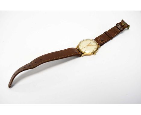 A 9ct yellow gold cased wristwatch, by Audax, fitted manual wind movement, on brown leather strap.