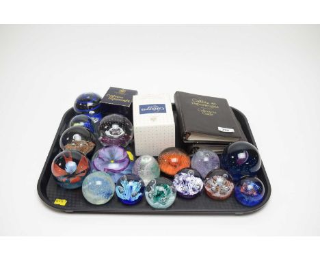 A collection of Caithness Glass paperweights, including: ‘Enigma'; 'Weaver 2005'; 'Starwatch'; 'Persephone'; 'Thoughtfulness 