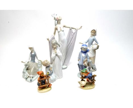 A Lladro ceramic ‘Grand Dame’ figure of a lady, 34cms high; together with two Lladro figures of children; a Lladro figure of 