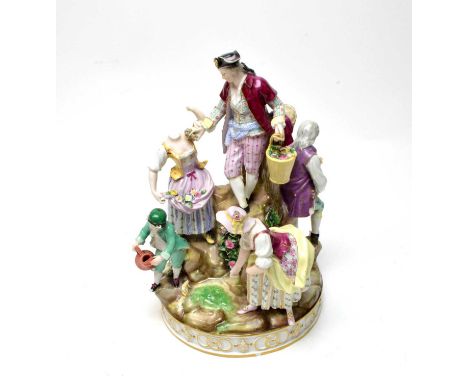 A Meissen ceramic figure group, with crossed swords mark to underside, 30cms high. A/F