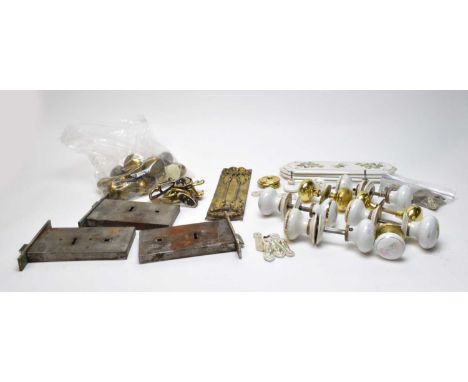 A selection of door fittings and adornments, including: set of four floral decorated ceramic door touch plates and matching d