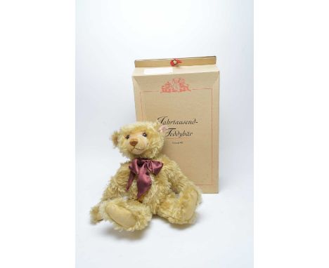 A Steiff ‘Year 2000’ Teddy Bear, ‘blond 43’, no. 1922, with box and certificate.
