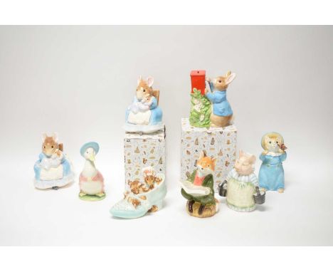 A collection of Border Fine Arts Beatrix Potter ceramic money banks, including: ‘Old Woman who Lived in a Shoe’; ‘Peter Rabbi
