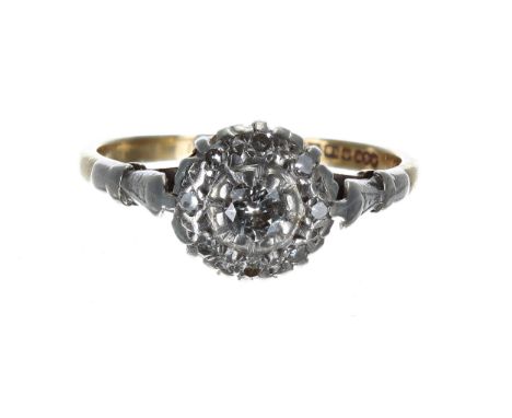 18ct and platinum diamond cluster ring, the centre diamond 0.07ct approx, 2.6gm, 9mm, ring size K 