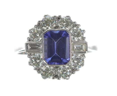 Attractive tanzanite and diamond platinum cluster ring, the tanzanite of good colour 1.30t approx, in a mixed-cut diamond sur