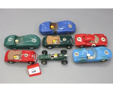 Seven slot cars: Scalextric Austin Healey 3000 in green, RN16; Scalextric Austin Healey 3000 in red, RN4; Scalextric C82 Lotu