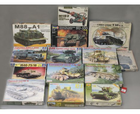 Thirteen boxed military related model kits by Revell, Eastern Express, Italeri and others, including tanks and military vehic