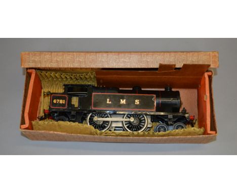 O Gauge. A Hornby clockwork 4-4-2 LMS Tank Engine in black, overall appears G but missing key in G 'basket weave' type lidded