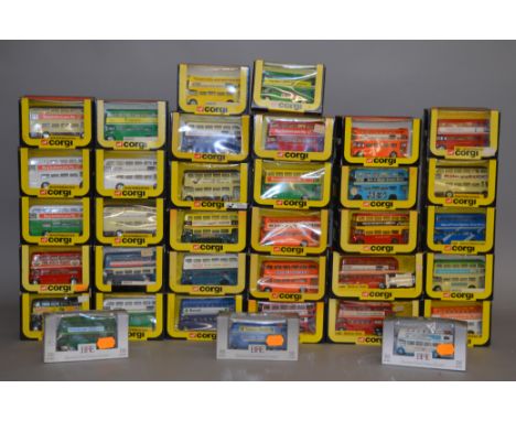 Thirty two boxed Corgi diecast Routemaster model buses in a various different liveries, including 488 'New Corgi Company' (gr