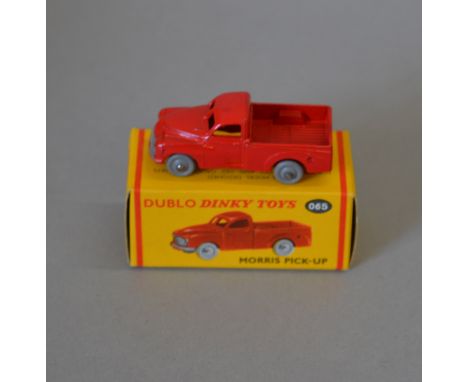 Dublo Dinky Toys 065 Morris Pick-Up in red with grey smooth wheels. Model is G+, some small areas of paint wear and small pat
