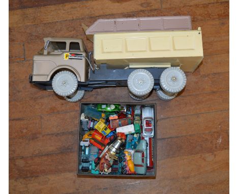 An unboxed Marx 'Powerhouse' pressed steel six wheel Hydraulic Dump Truck, F/G missing roof horns and with age related distor