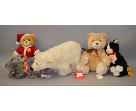 Five Steiff teddy bears: Polar Bear; Kuschel Hund; Tapsy Cat; Christmas Teddy; Orsi. All VG with chest tags. (5)