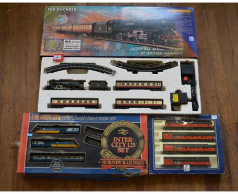 OO Gauge. Two boxed Hornby sets, R.545 'Inter-City 125', very grubby in P box and R.1004 'The Duchess', G in G box. A Lima 14