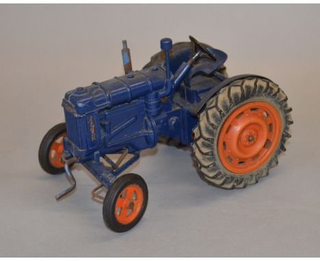 An unboxed Chad Valley diecast large scale model of a Fordson Major Tractor, approximately 18cm in length, having a dark blue