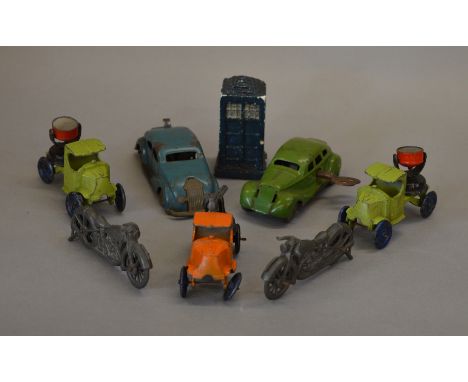 Five unboxed Johillco metal models, including three 'Mack' style trucks, two with searchlights, the other having a mounted gu