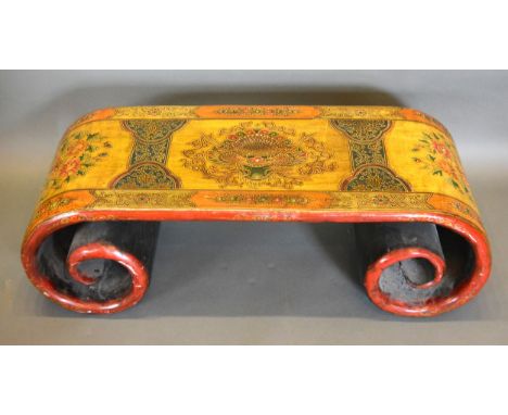 A Chinese lacquered Opium table of scroll form, 111cms wide, 45cms deep, 36cms high 