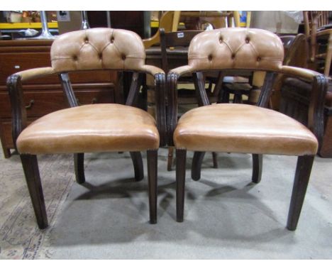 A pair of reproduction Georgian style open armchairs with pale tan leather upholstered seat, button back and arms within moul