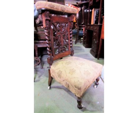 A Victorian oak framed prayer chair with carved and moulded frame and upholstered seat and back rail, raised on turned forele